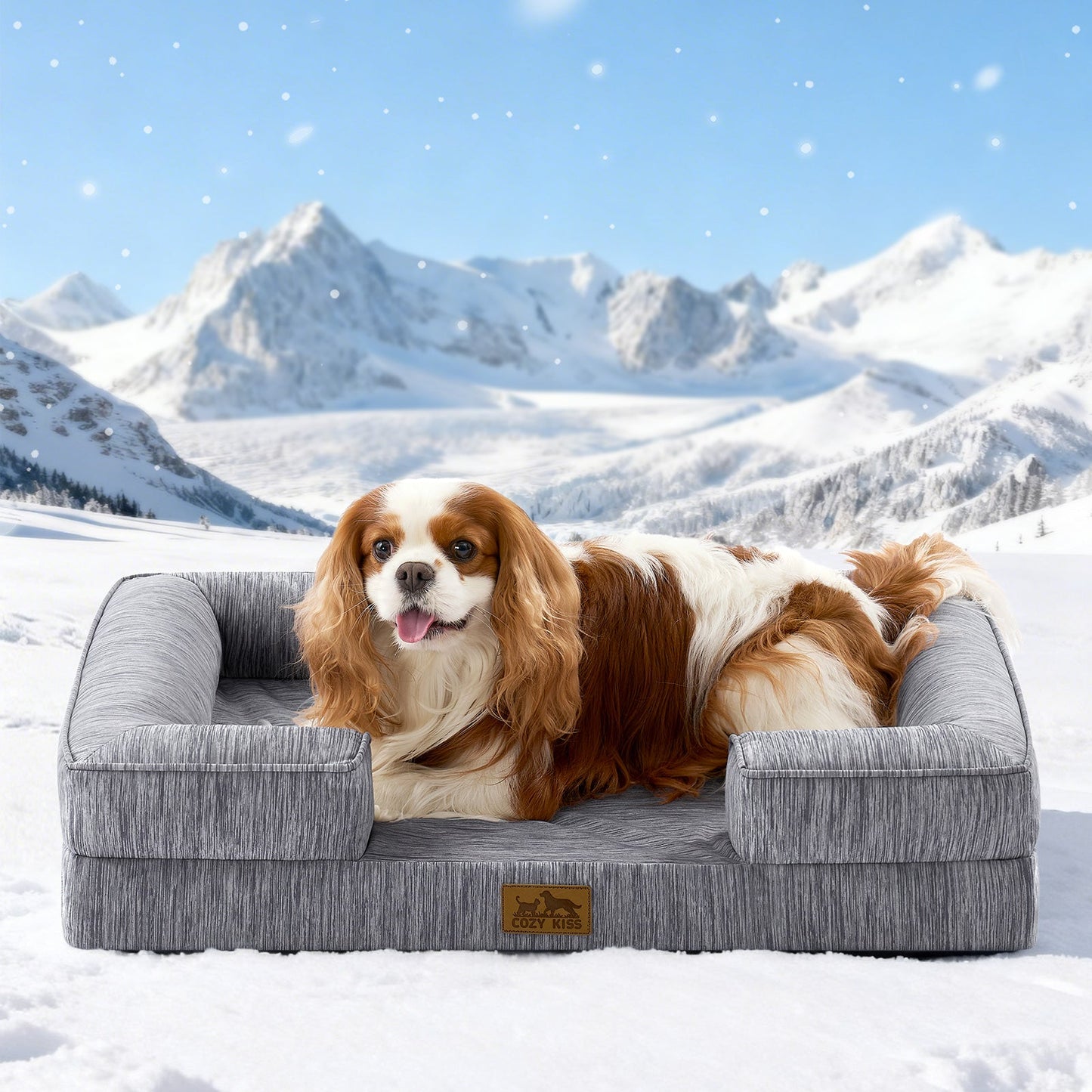 Dog lying on Cozy Kiss grey pet bed in a snowy landscape with mountains.#color_Dark Grey