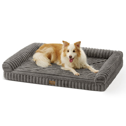 Dog lying on Cozy Kiss Striped Faux U-Shaped Washable Dog Bed, showing raised bolsters and soft striped texture. #color_Grey