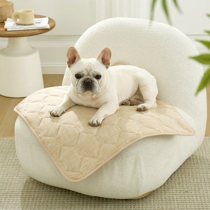 Dog lying on Cozy Kiss cooling mat on a white sofa in a cozy room.#Color_Beige