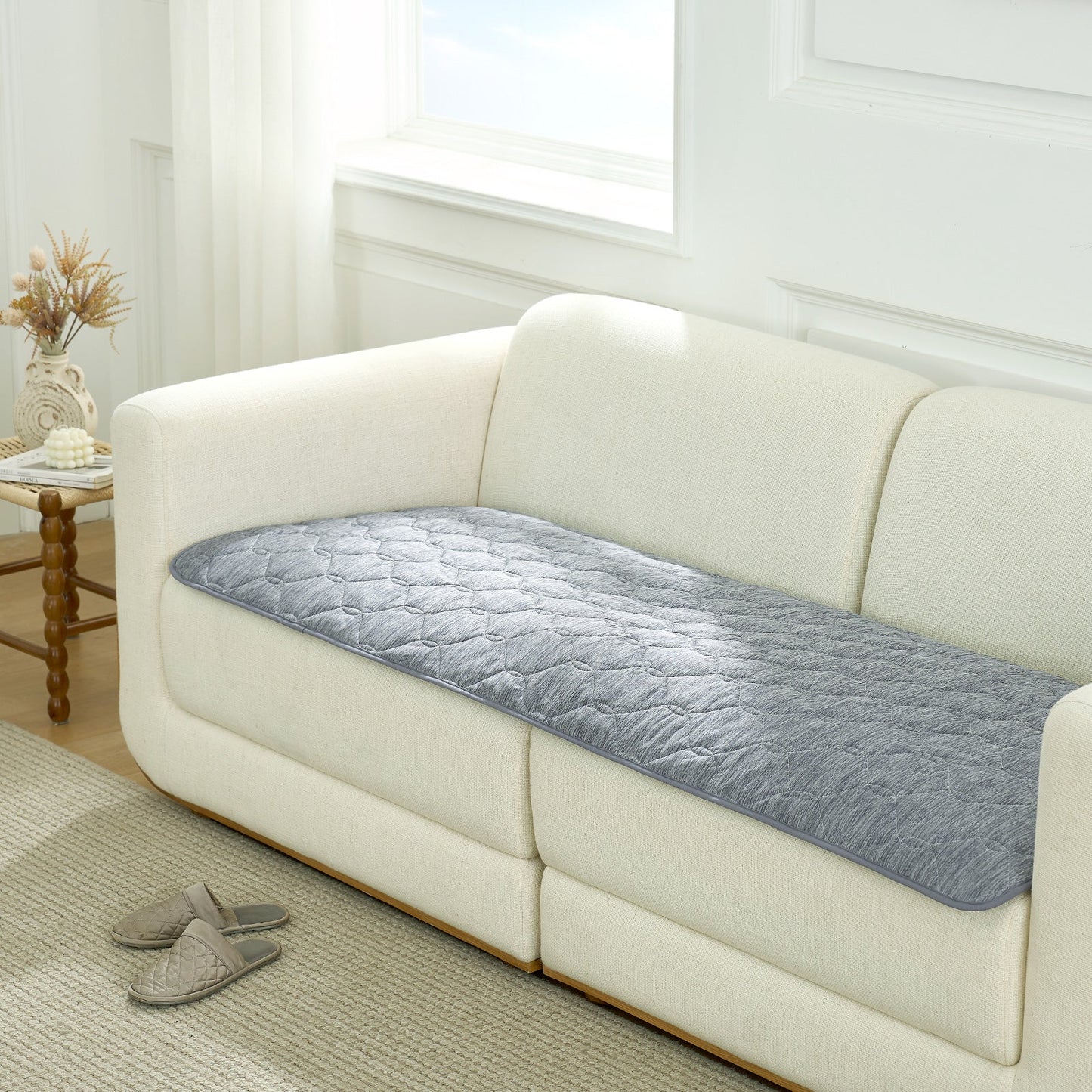 Cozy Kiss grey couch cover on a white sofa in a living room setting.#color_Dark Grey