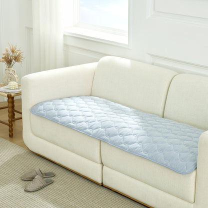 Cozy Kiss blue couch cover on a white sofa in a living room setting.#Color_Sky Blue
