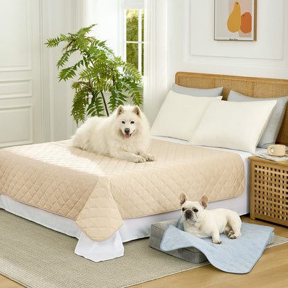 Cozy Kiss Diamond-Quilted Leakproof Cooling Couch Cover on bed with a dog sitting on it #color_Beige
