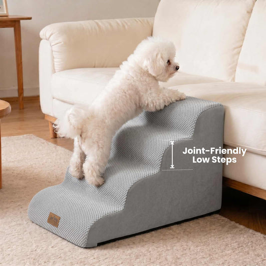Side lifestyle view of Cozy Kiss 4-Step Gentle Slope Curved Pet Stairs featuring low-rise steps designed to reduce joint strain for small dogs #color_Gray