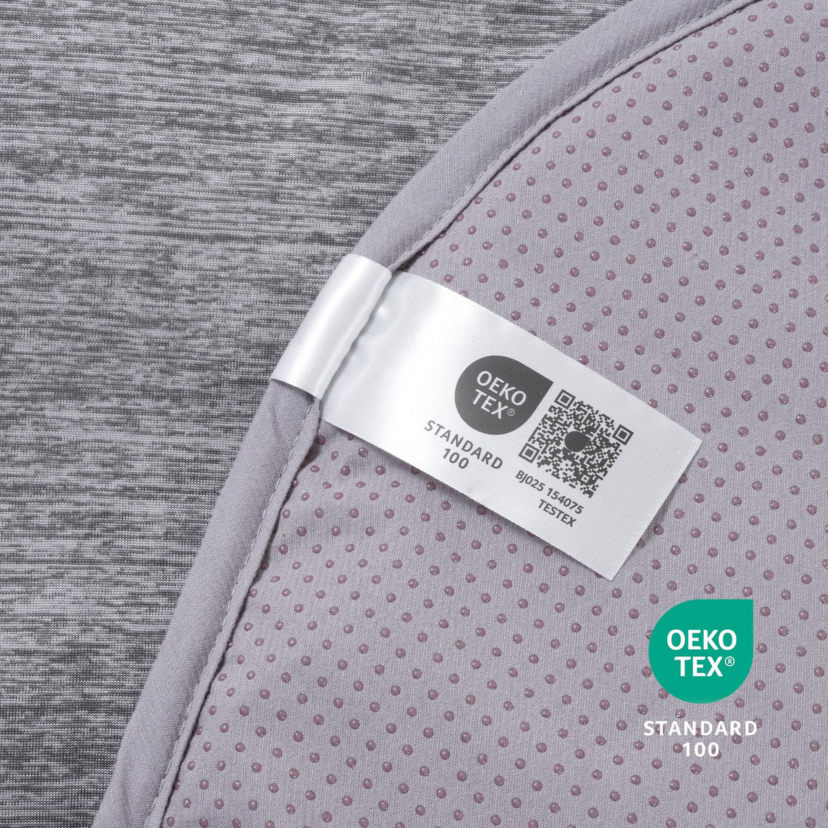 Oeko-Tex label on gray paw-shaped cooling pet mat fabric.