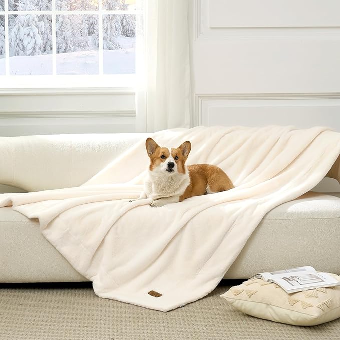 Cozy Kiss Leakproof Faux Fur Pet Blanket in Cream White front view with a dog sitting on it. 